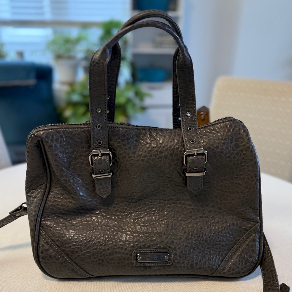 Steve Madden grey bag with faux metal rivets on ends handles and shoulder strap